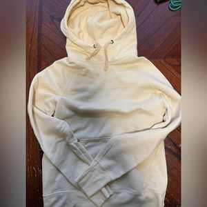 Light yellow Champion Hoodie.